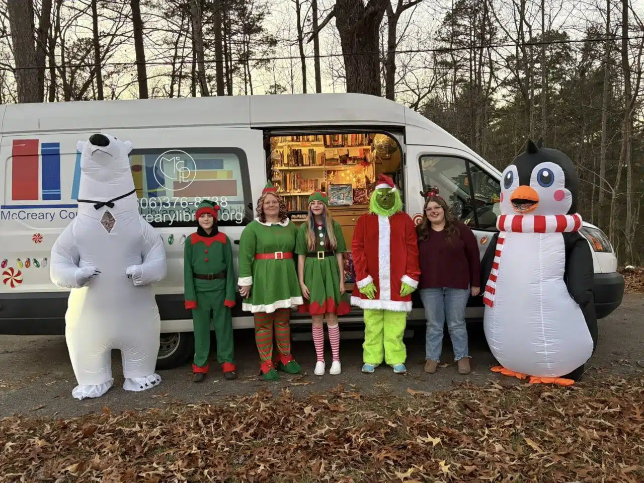Photo of a group of people standing by the bookmobile